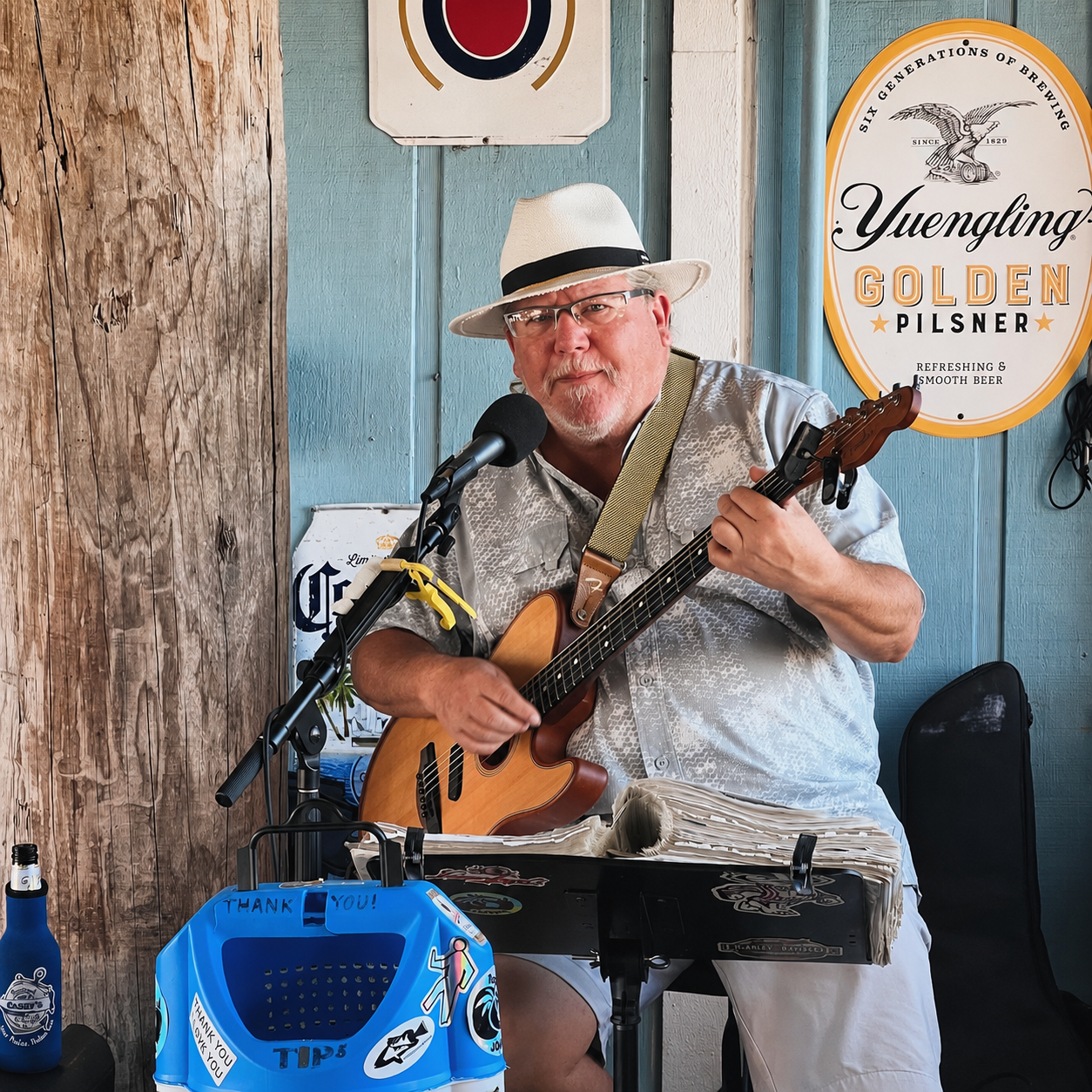 Drummer performing at sunset with Florida Keys waterway in the background